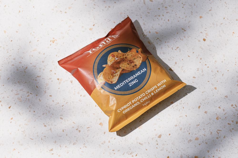 Mediterranean Zing 140g bag lying at an angle on terrazzo